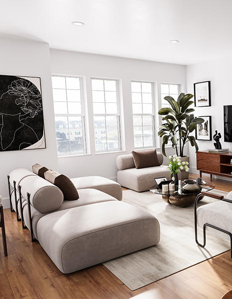Model living room at Shoregate Apartments in Bay Shore, featuring wood grain floor paneling and beige couches.